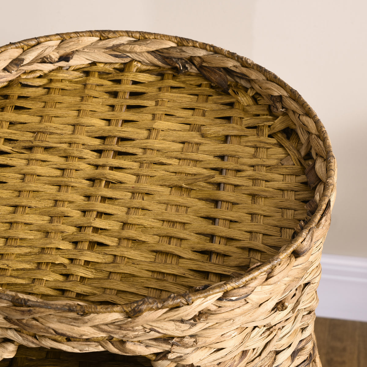 Close-up of the natural woven water-hyacinth weave on the cat tower bed
