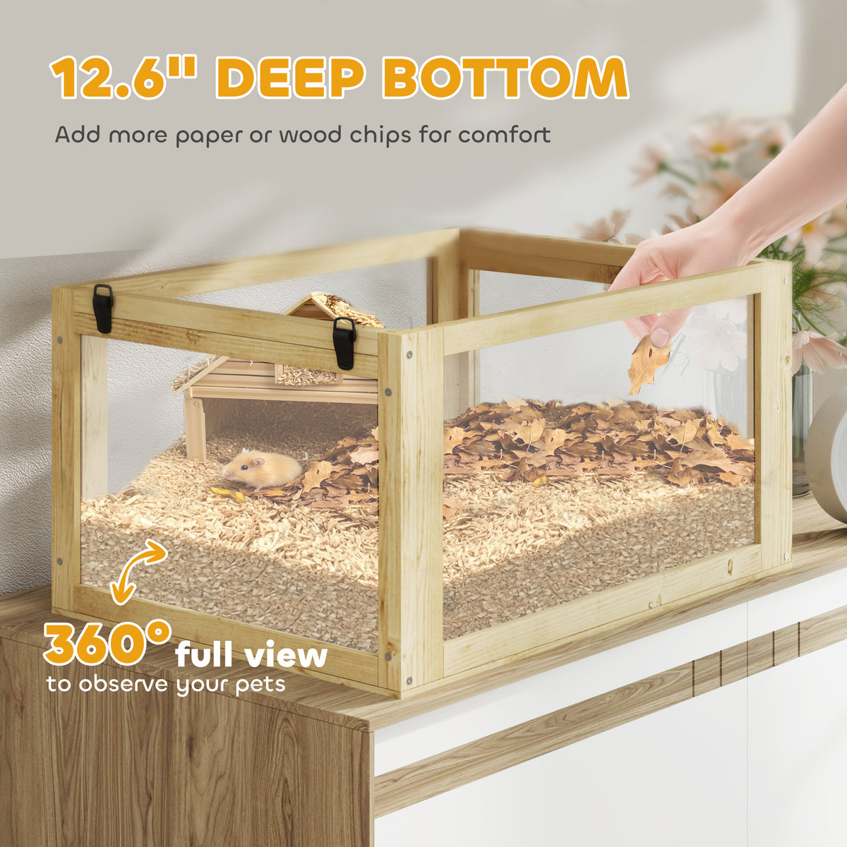 Hand adding wood shavings to the 12.6 inch deep base of the wood and acrylic hamster cage