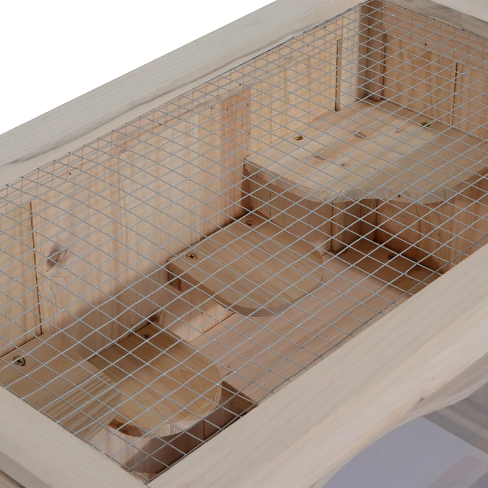 Close-up of the mesh wire lid over the wooden hamster cage interior