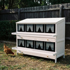 White wooden 8-compartment chicken nesting box in a backyard - wrenwood hero