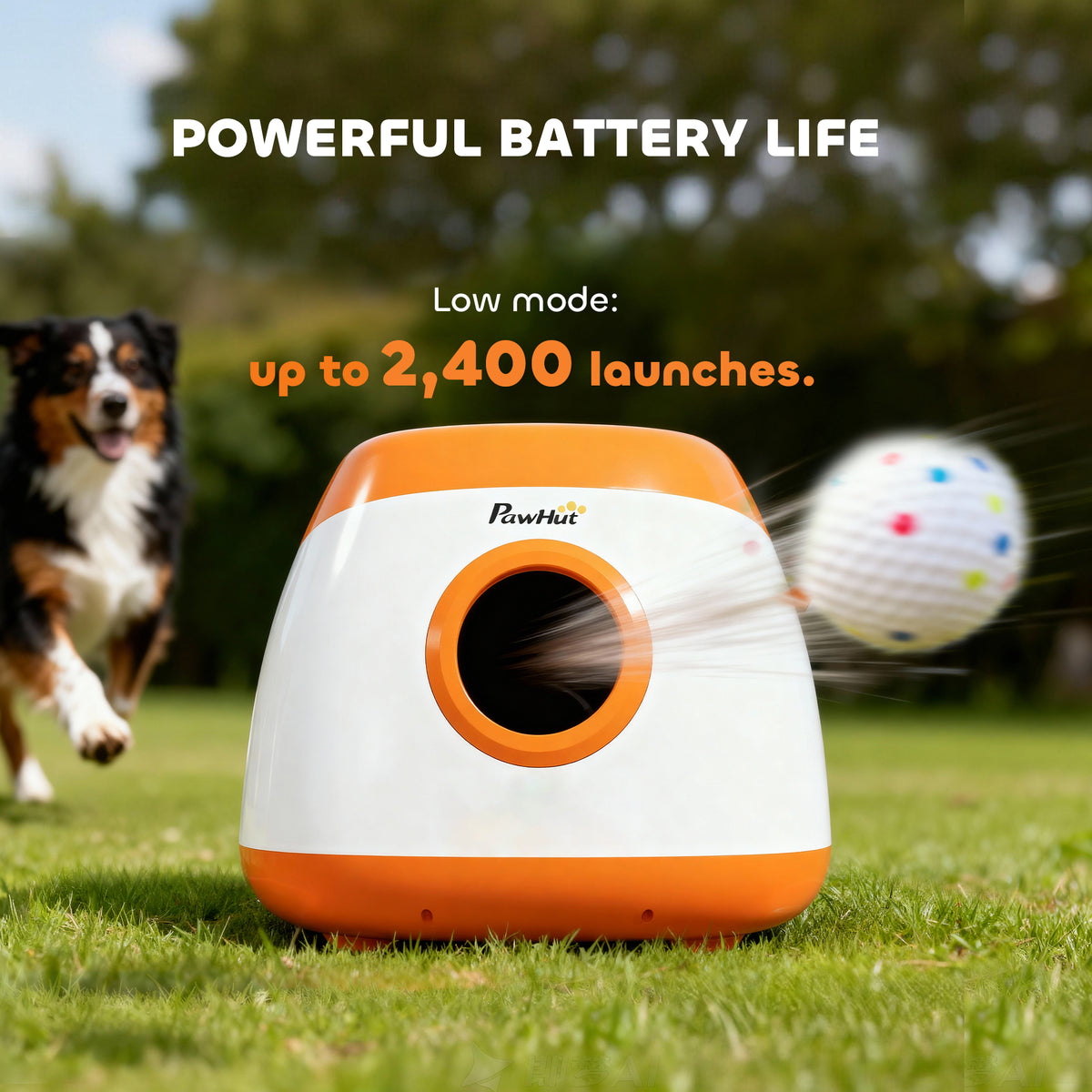 Orange and white automatic ball launcher firing a ball on a lawn, with a dog running up behind it