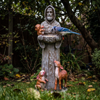 Blue jay feeding at the St. Francis statue bird feeder in a shaded garden - lifestyle v2