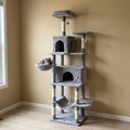 Tall grey multi-level cat tree tower with condos and sisal posts in a living room - wrenwood hero