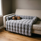 Grey plush pet mat over a sofa seat with a small dog asleep on it - wrenwood hero