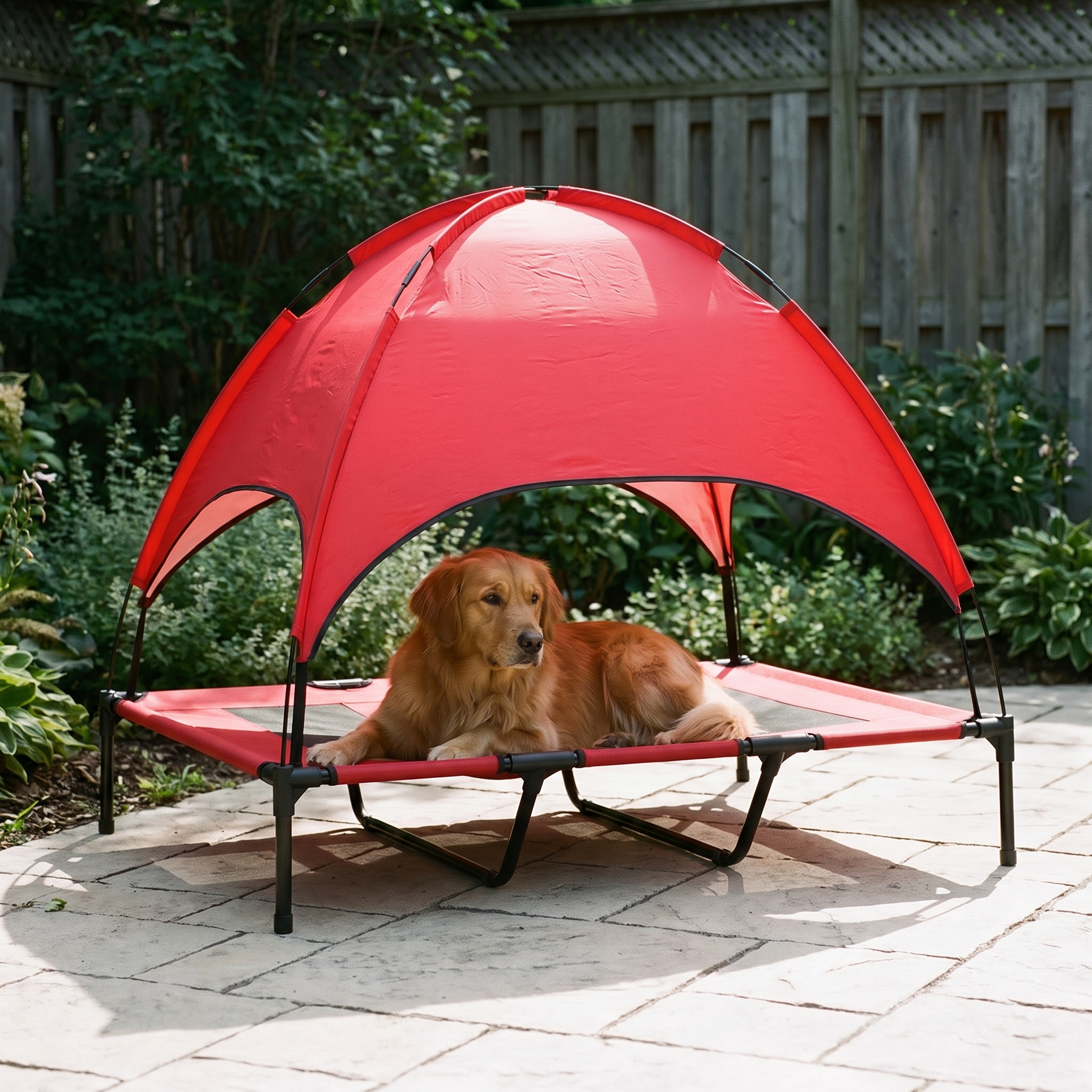 Elevated mesh dog cot with a red canopy shade in a backyard with a dog resting on it - wrenwood hero