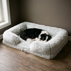 White shaggy plush winter pet bed in a living room with a small dog curled inside - wrenwood hero