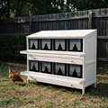 White wooden 8-compartment chicken nesting box in a backyard - wrenwood hero