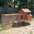 Extra large wooden chicken coop with nesting box and run in a backyard - wrenwood hero