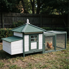 Cottage-style wooden chicken coop with run in a backyard - wrenwood hero