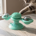 Mint green cat windmill teaser toy with a cat paw reaching in - wrenwood hero