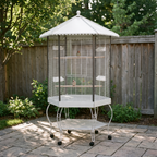 Hexagonal flight bird cage with canopy and stand on a garden patio - wrenwood hero