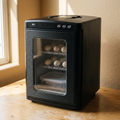 Digital reptile egg incubator with eggs on shelves, on a wooden table - wrenwood hero