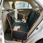 Waterproof quilted dog car seat cover fitted across a back seat with a small dog resting on it - wrenwood hero
