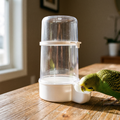 Clip-on bird cage water dispenser with a budgie drinking - wrenwood hero