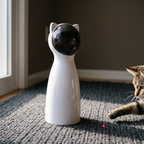 White automatic rotating laser cat toy on a rug with a cat watching the dot - wrenwood hero