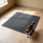 Waterproof honeycomb cat litter mat on a wood floor with a cat stepping off it - wrenwood hero