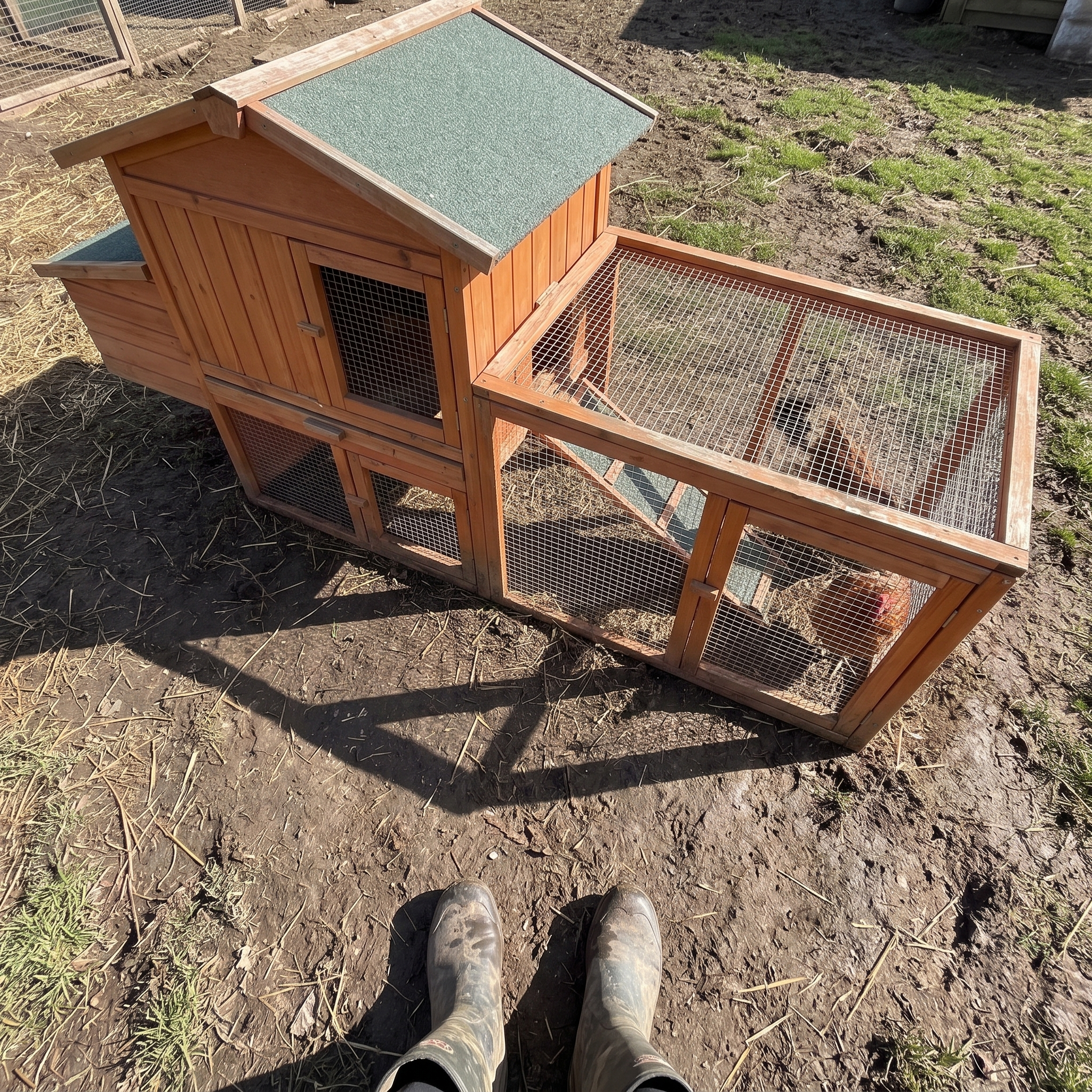 keeper's boots by the wooden chicken coop run - wrenwood ugc lifestyle v2