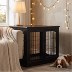 Black wooden dog crate end table in a warm living room with subtle string lights and a cavalier king charles spaniel - wrenwood hero v2