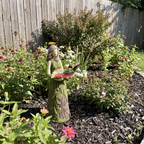 Fairy hummingbird feeder among garden flowers with a hummingbird hovering - wrenwood ugc lifestyle v2