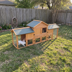Wide backyard view of the oversized rabbit cage with a white rabbit in the run - wrenwood ugc lifestyle v2