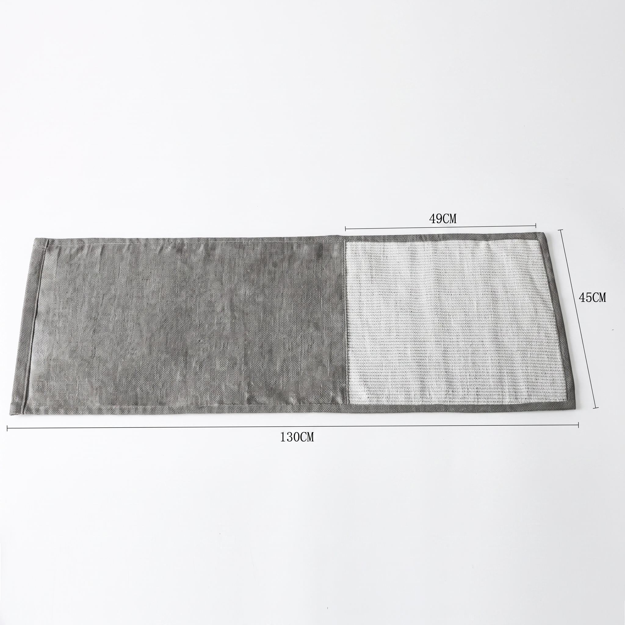 Grey rectangular mat lies flat on a white background with dimension measurements labelled.