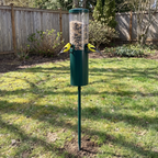 Goldfinches on the squirrel-proof bird feeder pole staked into a backyard lawn - wrenwood ugc lifestyle v3