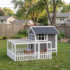 Grey compact chicken coop with white picket run and hens in a backyard - wrenwood hero v2