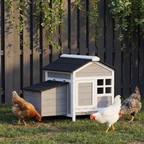 Wooden chicken coop with black roof and hens at dusk - wrenwood ugc lifestyle v3