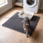 Cat stepping off the honeycomb waterproof litter mat in a utility room