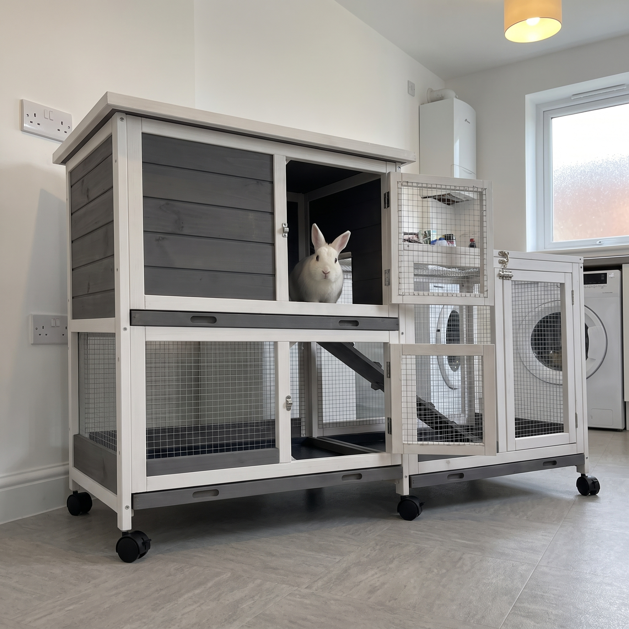 White rabbit in the elevated indoor wooden rabbit hutch with ramp in a tidy utility room