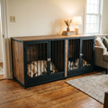 75-inch double dog crate console in a living room with two dogs lying inside, one in each compartment